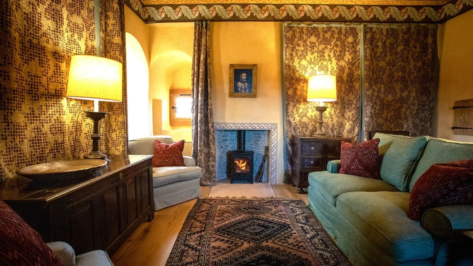 The sitting room at Fairburn Tower, lime plastered beneath the painted ceiling, with its new stove and oak floor, fitted out for The Landmark Trust