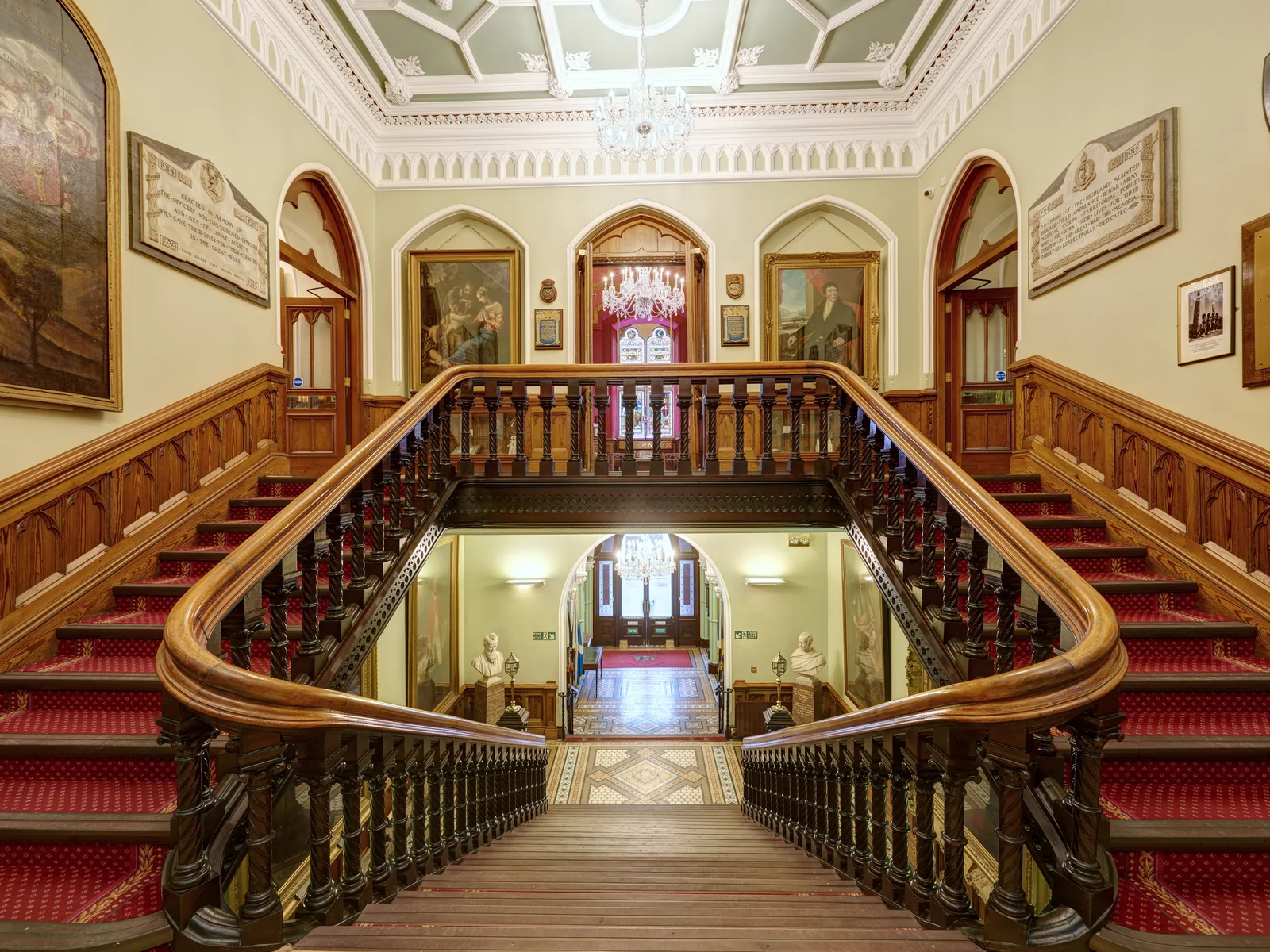 Inverness Town House: the main staircase redecorated in the 1882 colours, with the chandeliers restored and rehung on new winches