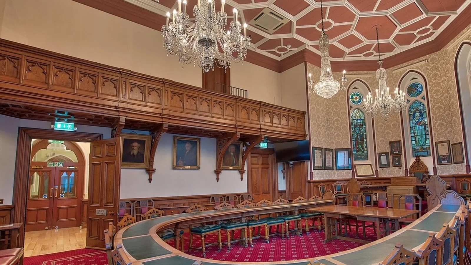 Inverness Town House: the council chamber redecorated, with its horseshoe table, panelling, gallery and stained glass behind the provost's chair