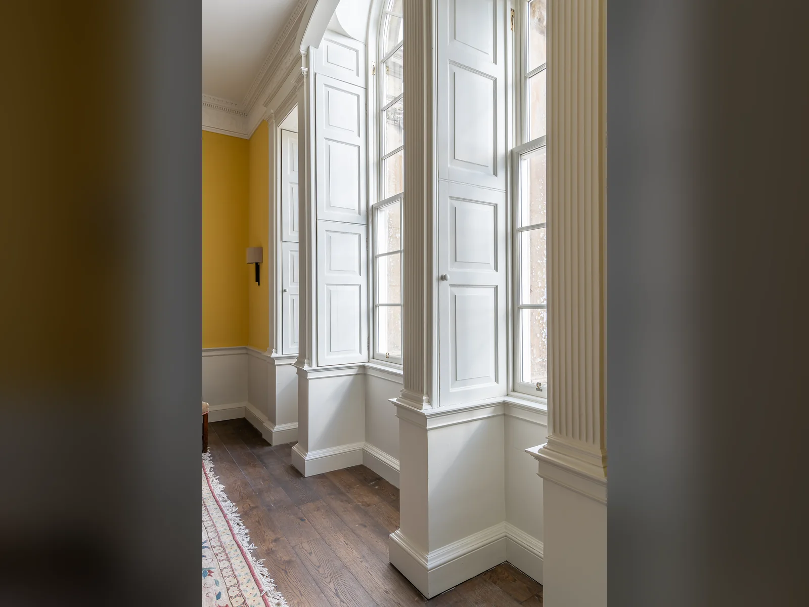 Panelled shutters and window linings made and fitted by our joiners, with the sash and case windows taped into the plaster reveals for airtightness