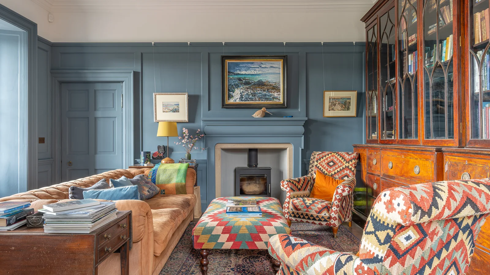 The library at Asknish House: panelling, chimneypiece and stove, finished and decorated ready for the family to move in