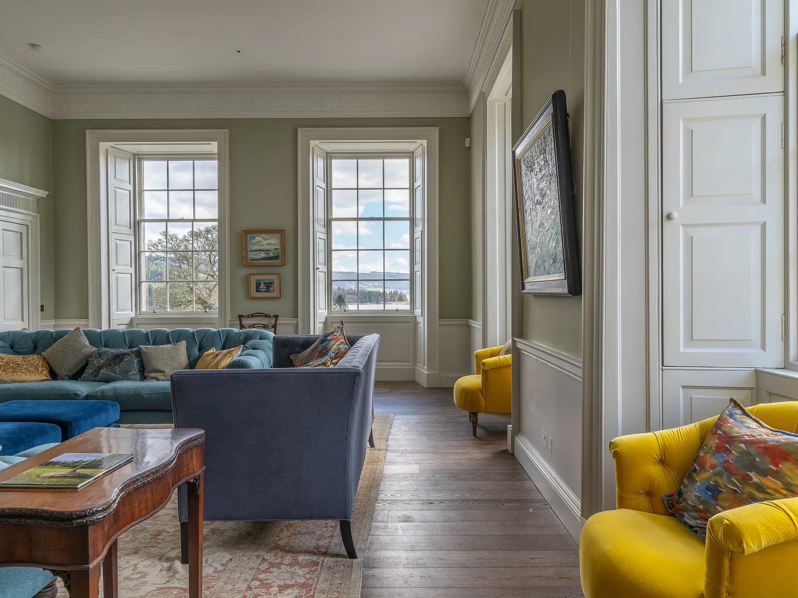 Asknish House: the drawing room, with panelled shutters and six-panel doors set into the restored lime plaster