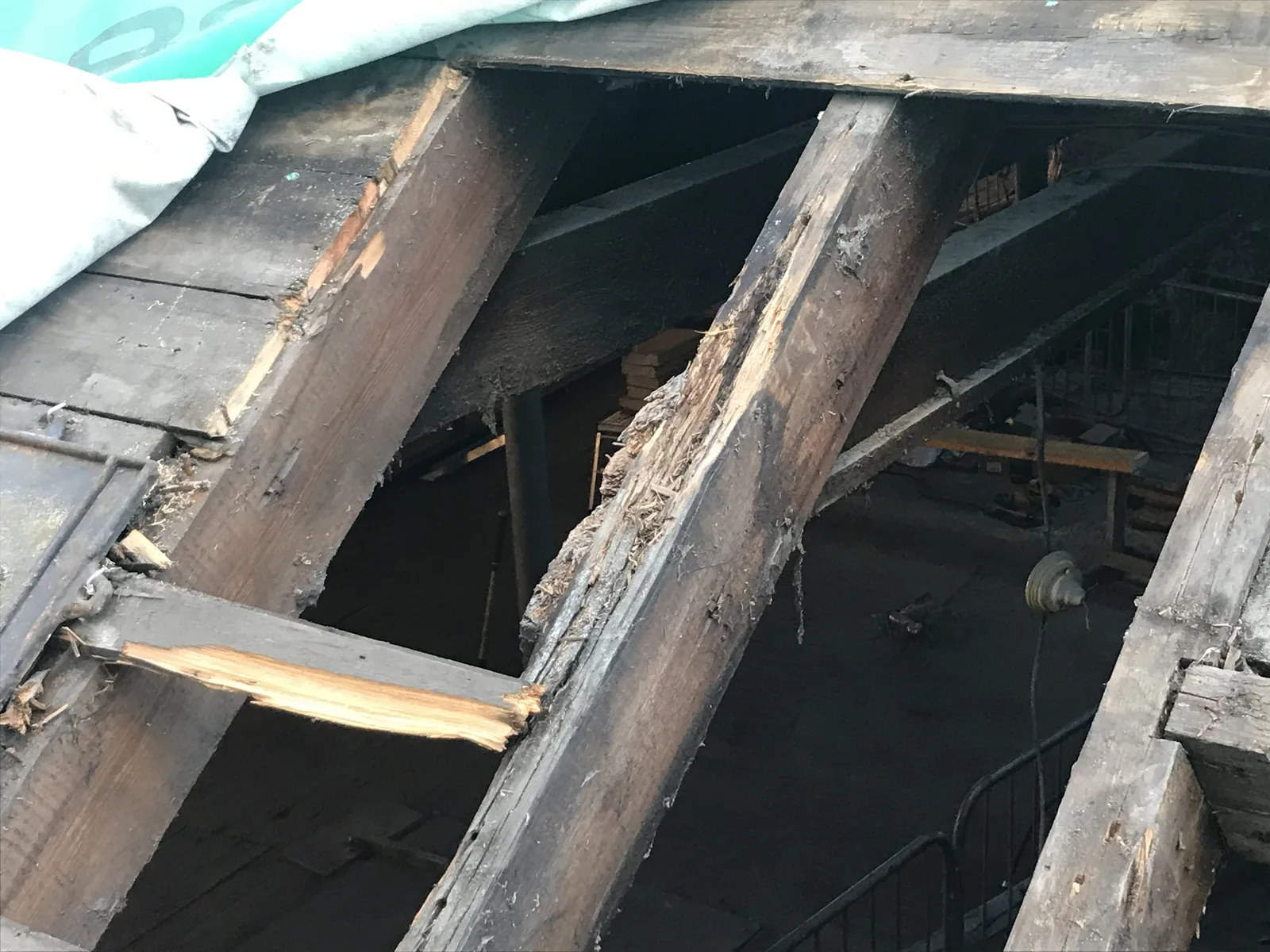 Rose Street Foundry: rotten floor joists exposed during the soft strip, before they were cut back and reused