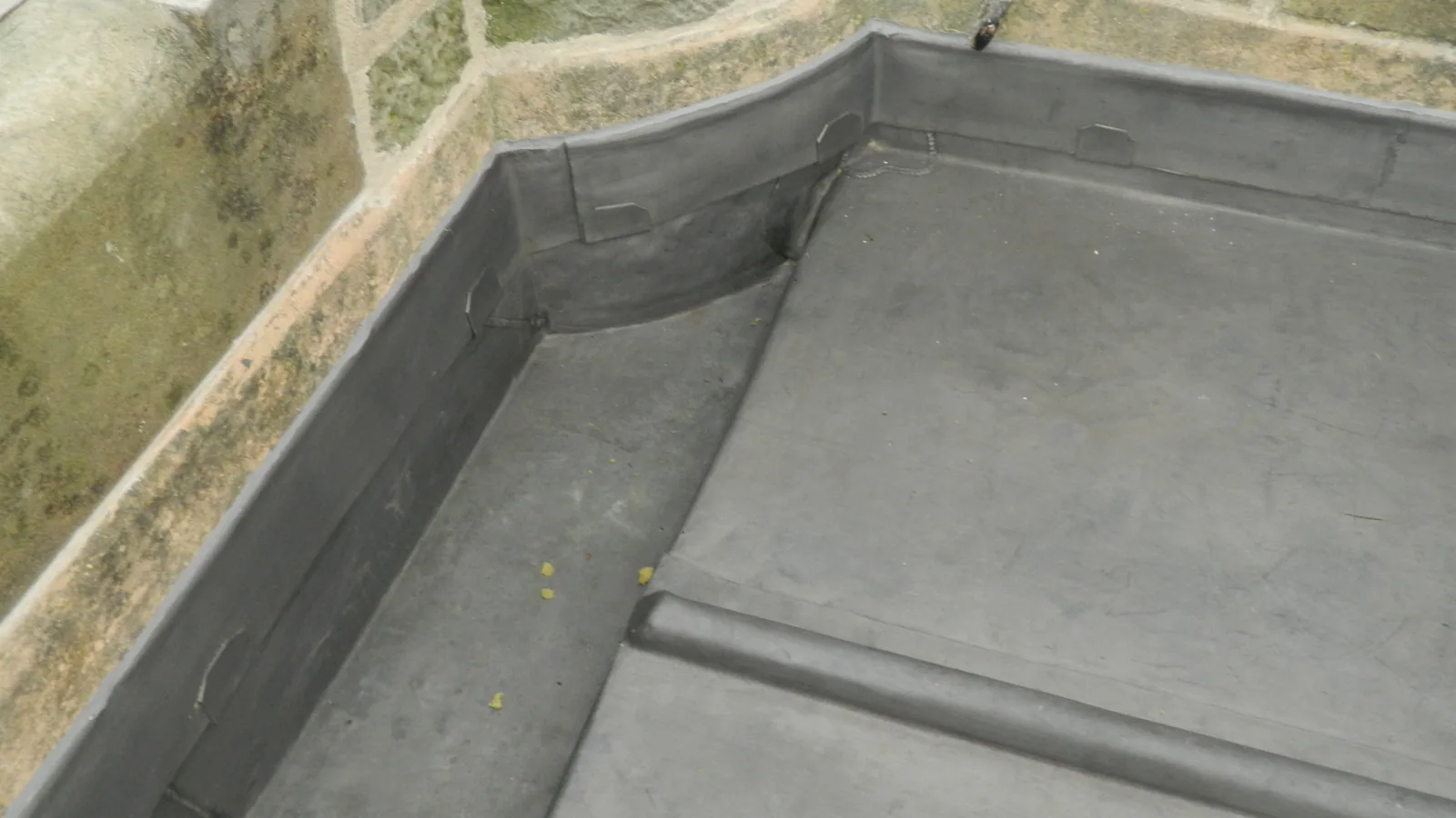 Lerwick Town Hall: the flat roof re-laid in sheet lead with wood-cored rolls, inside the granite parapet