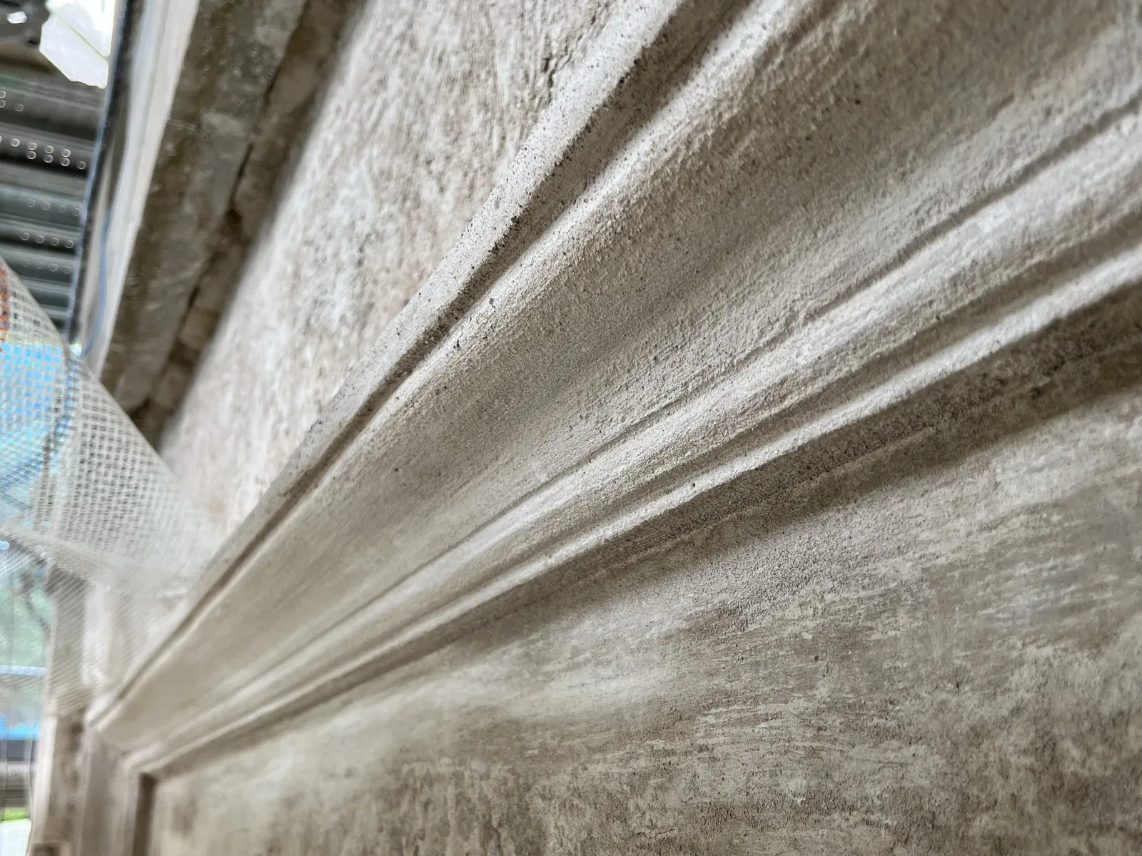 Run mouldings in lime render at The Haining, formed in situ with a profile cut to the original