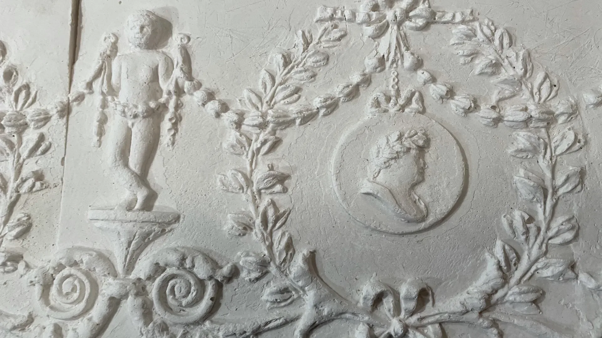 A Georgian plaster frieze of putti, garlands and medallions, newly cast in LTM's workshop