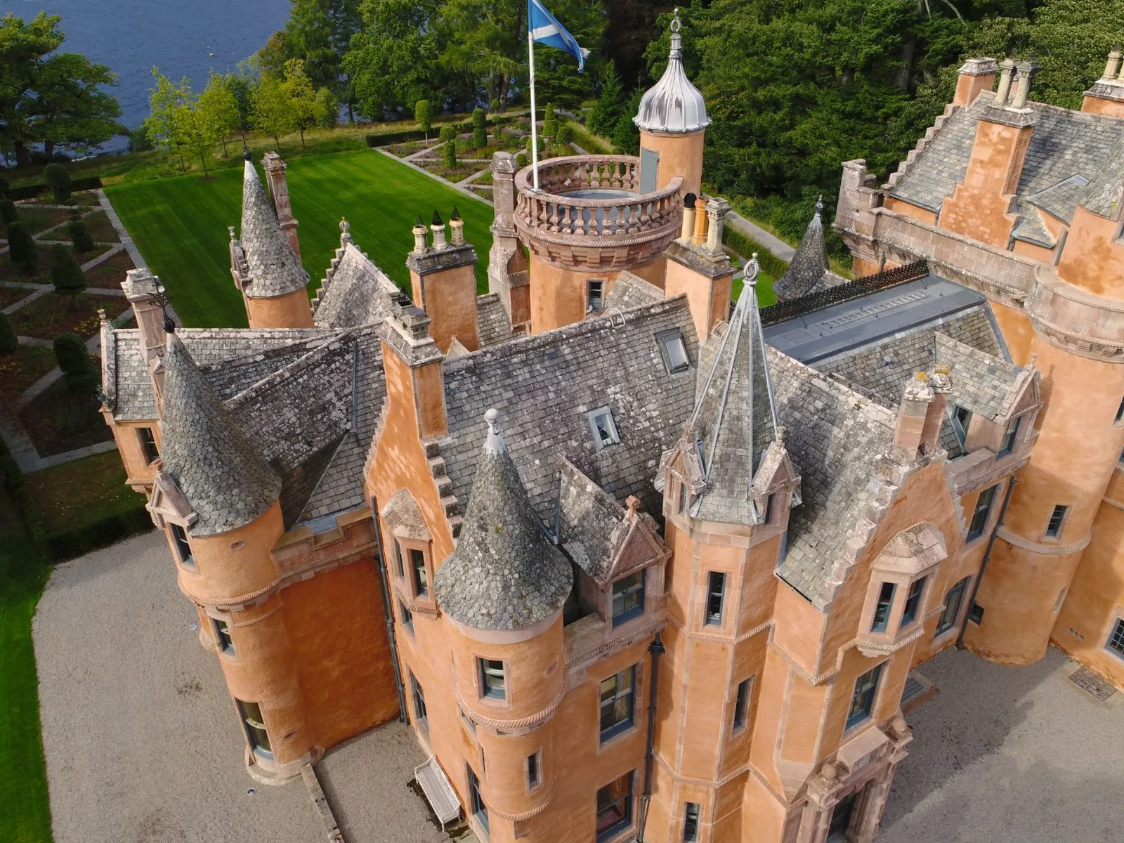 Aldourie Castle, Loch Ness: the slated roofs and turrets of the baronial castle