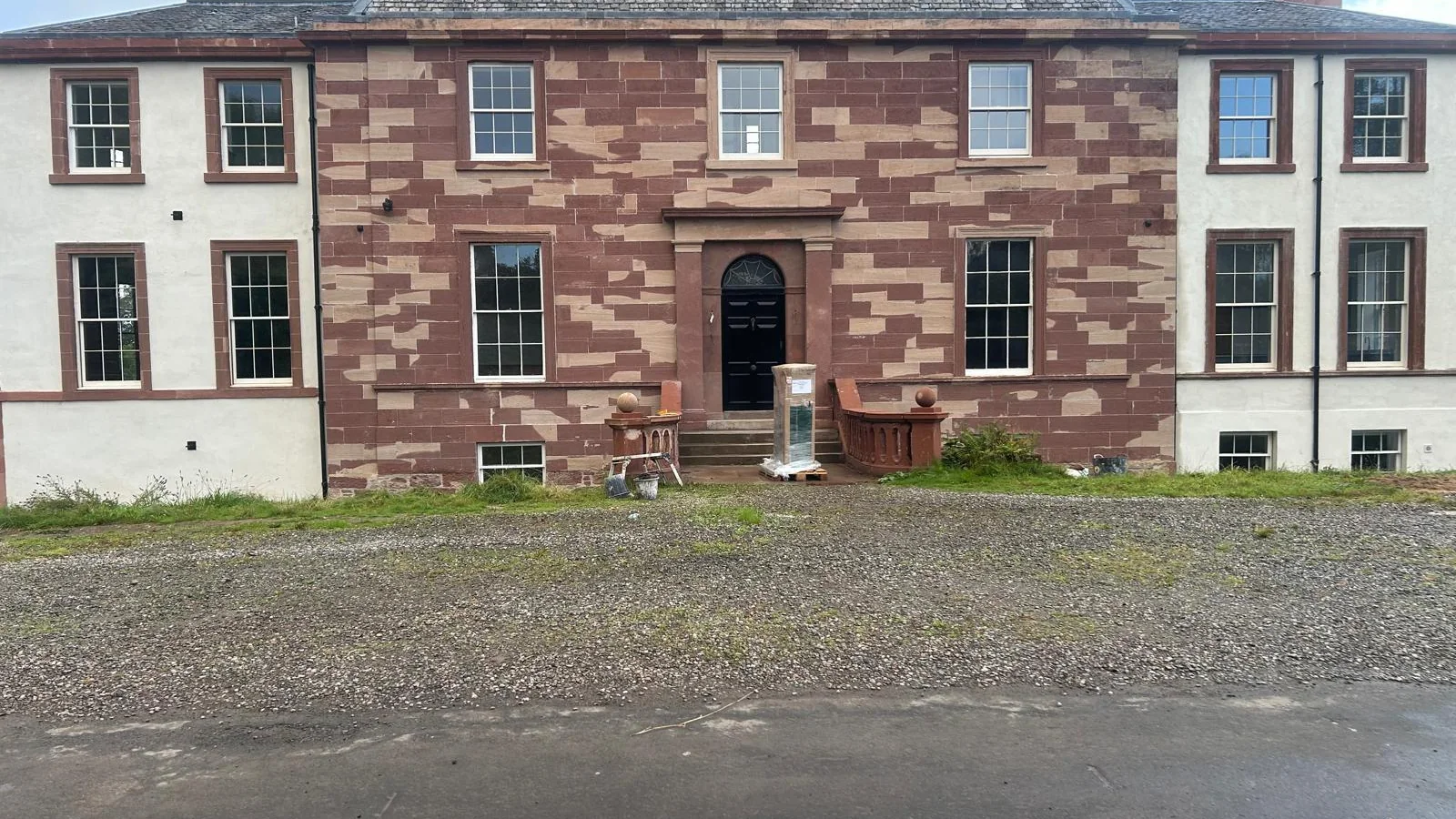 Finnich Malise House: the red sandstone bays and dressings DOFF cleaned and the old coatings removed with TORC, the harled walls limewashed