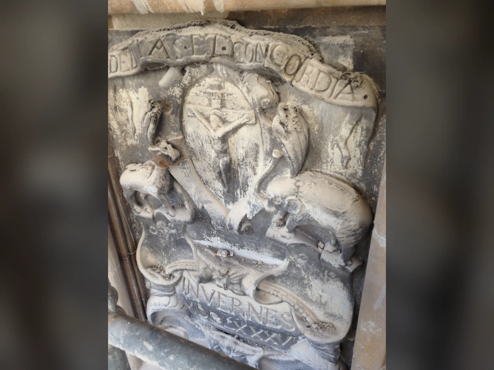 The 1686 burgh arms of Inverness as found: soiled, cracked and with carved detail lost