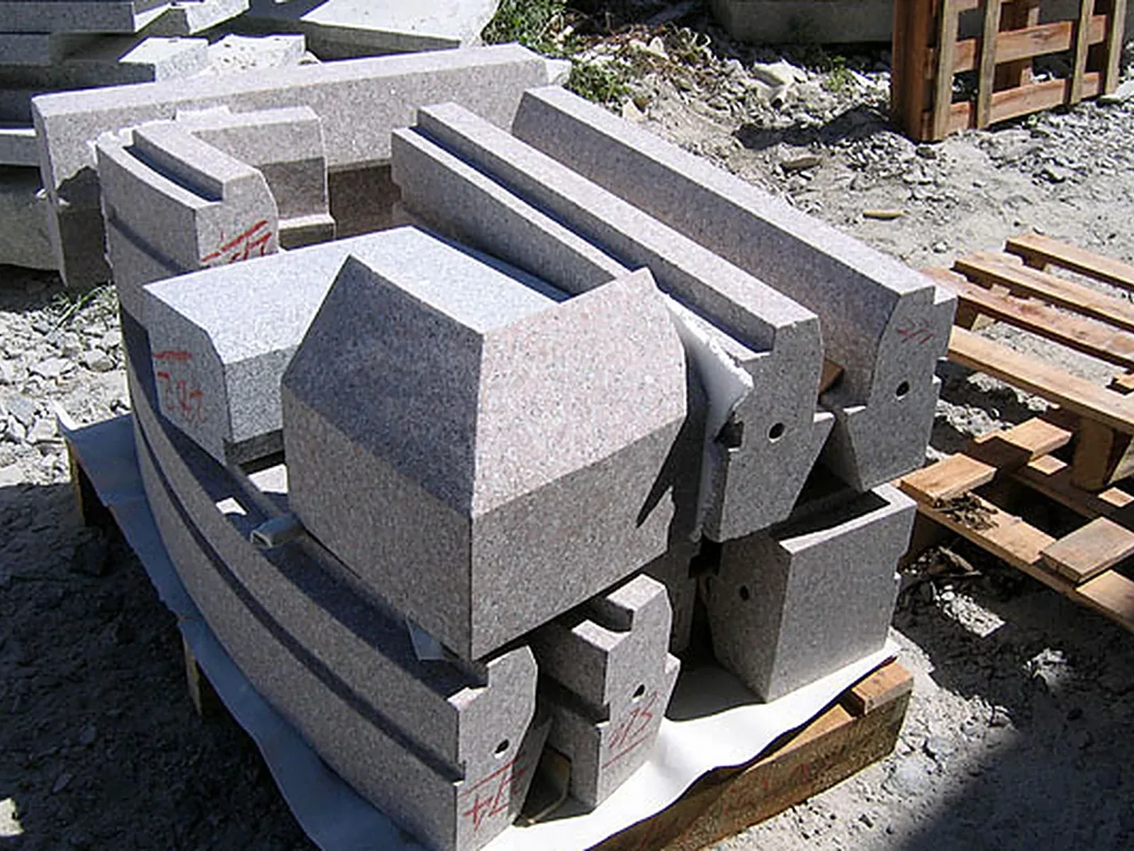 Dressed granite ready for the wall: quoins, arch stones and window dressings cut for a new-build chapel in the Highlands