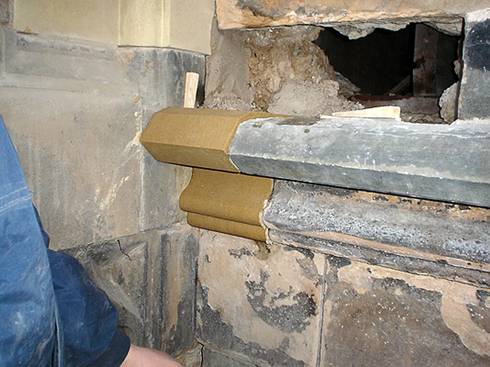 King's College Chapel, Old Aberdeen: a new moulded sandstone indent offered into the wall, cut and dressed in the banker shop we set up on site