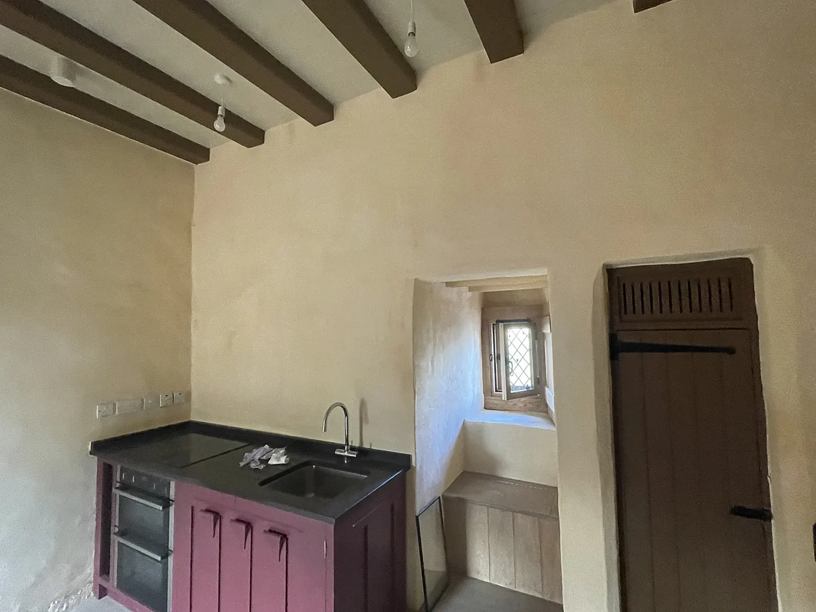 Fairburn Tower, Ross-shire: a room in the 16th-century tower lined with insulating plaster board and lime plaster for The Landmark Trust