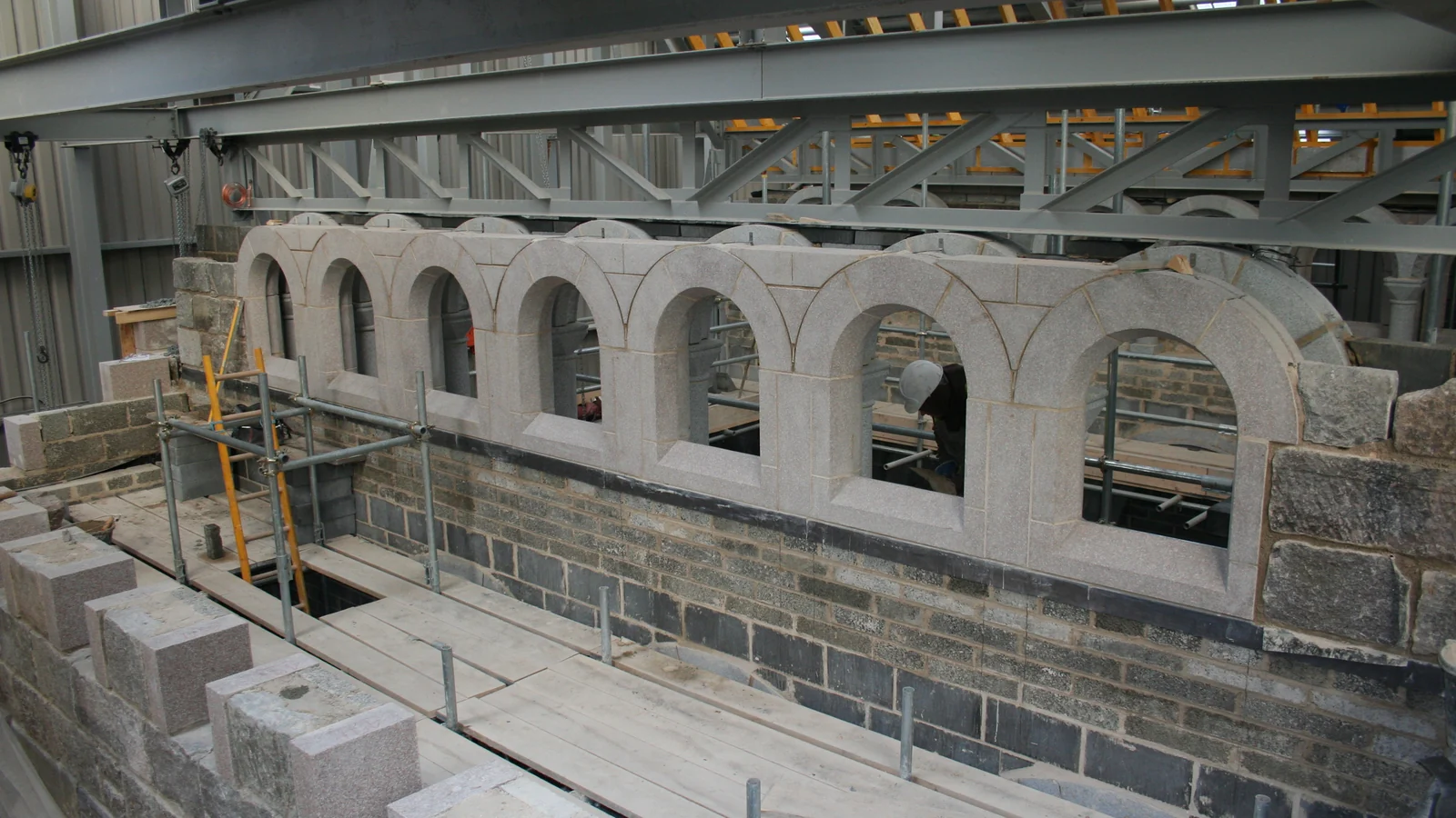 Ben Alder Chapel: the granite nave arcade built from cutting sheets for every arch stone, pillar and capital, inside the winter enclosure