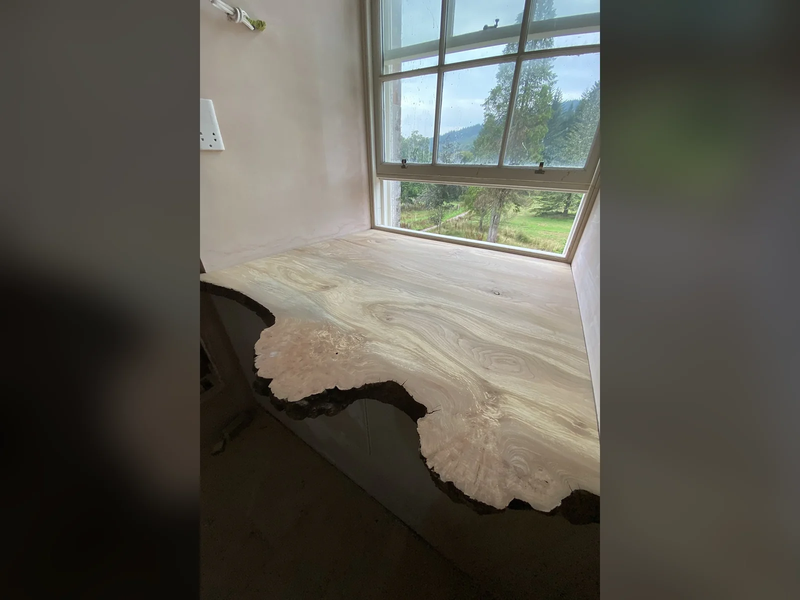Asknish House: a window reveal in the lime, cork and aerogel insulating plaster, applied 60 mm thick in four to five coats and finished with a polished lime skim